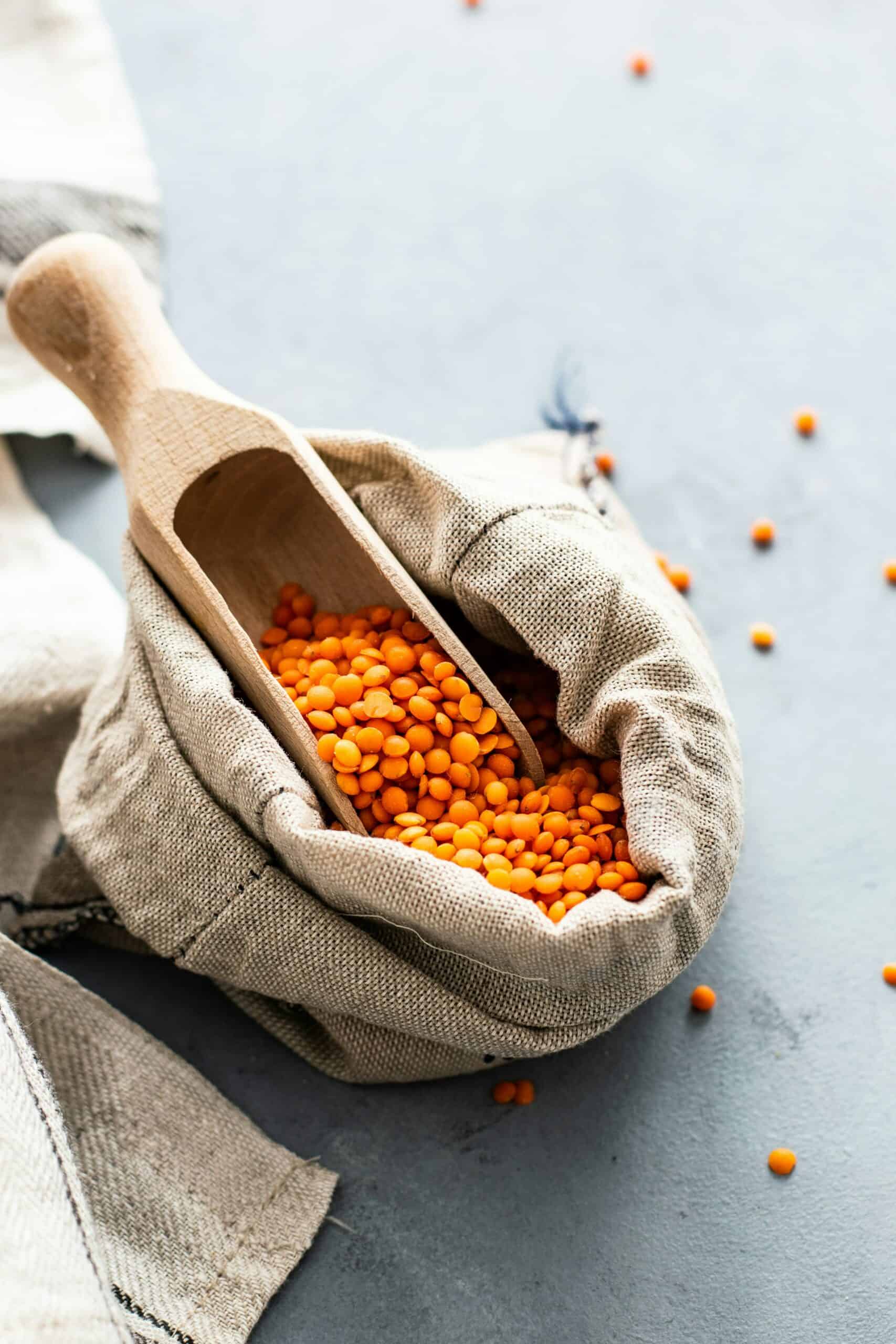 red lentils with scoop natural burlap bag