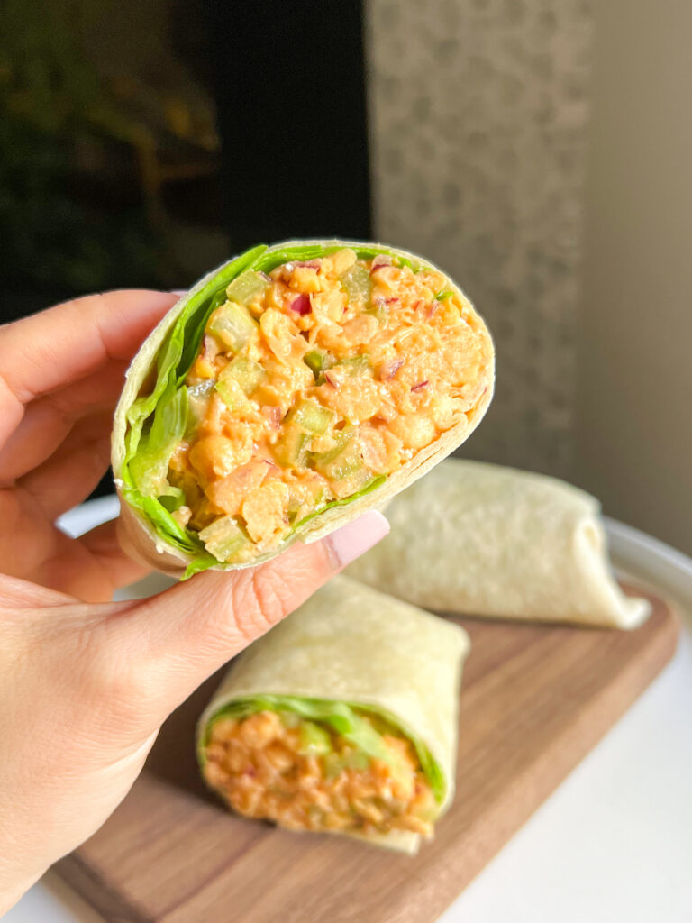 hand holding Chickpea Buffalo Wrap