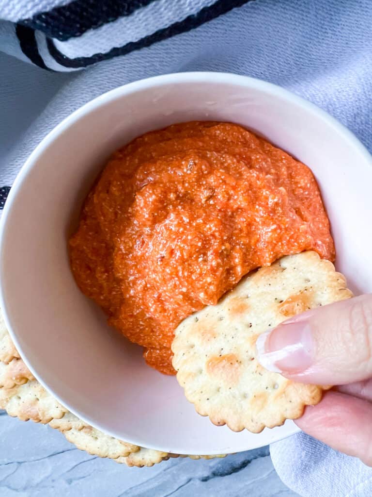 Roasted Red Pepper Dip Vegan with cracker dipping