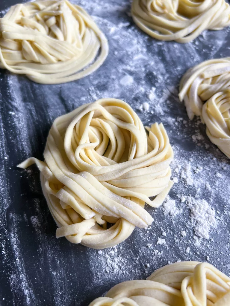 Homemade Vegan Pasta Noodles Close Up On Baking Sheet