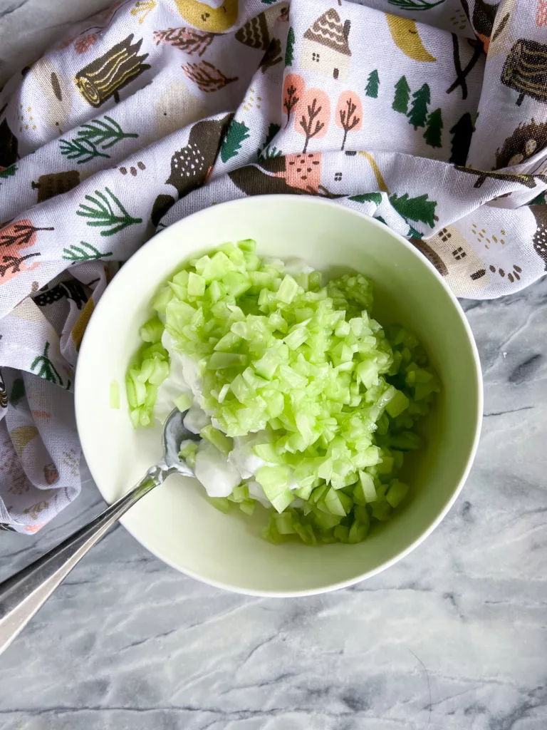 cucumber cut in white bowl