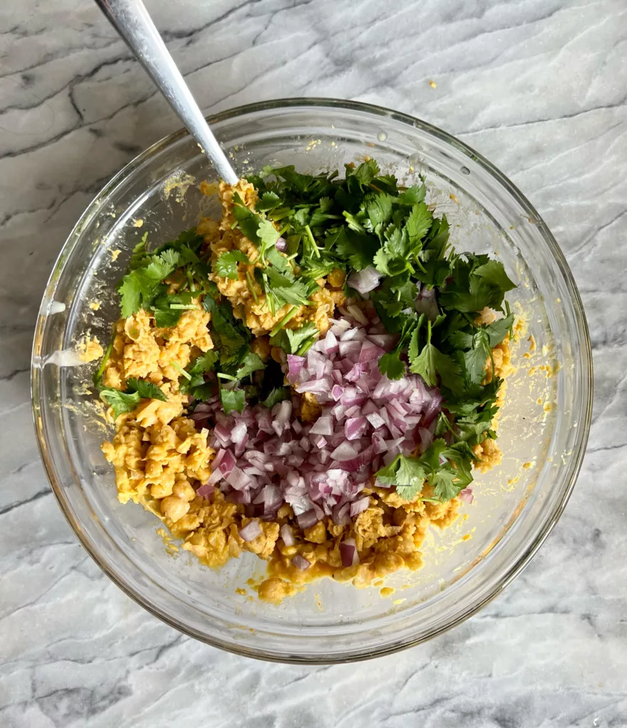 Vegan Chickpea Curry Wrap mixture in glass bowl