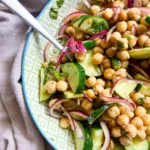 balsamic chickpea salad in white and green bowl close up