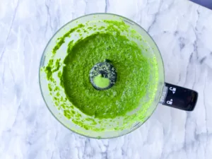 ingredients in food processor for green goddess dressing