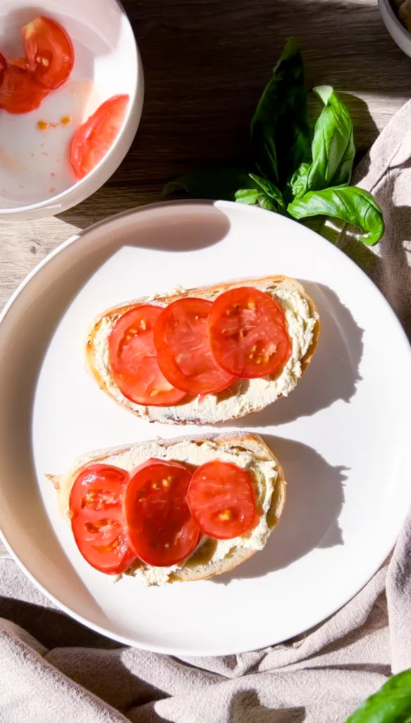 Sourdough bread sliced with cream cheese and tomato