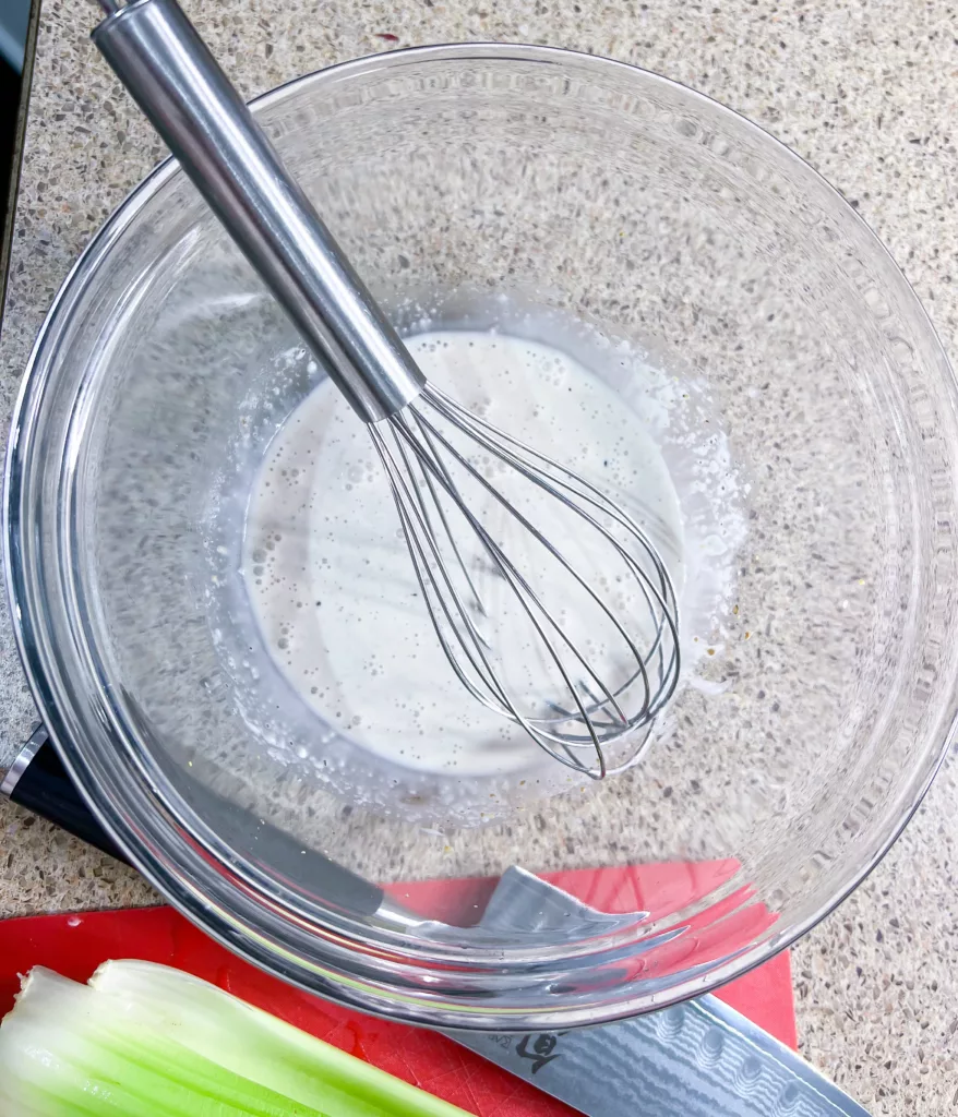 Mayo based dressing whisked in bowl