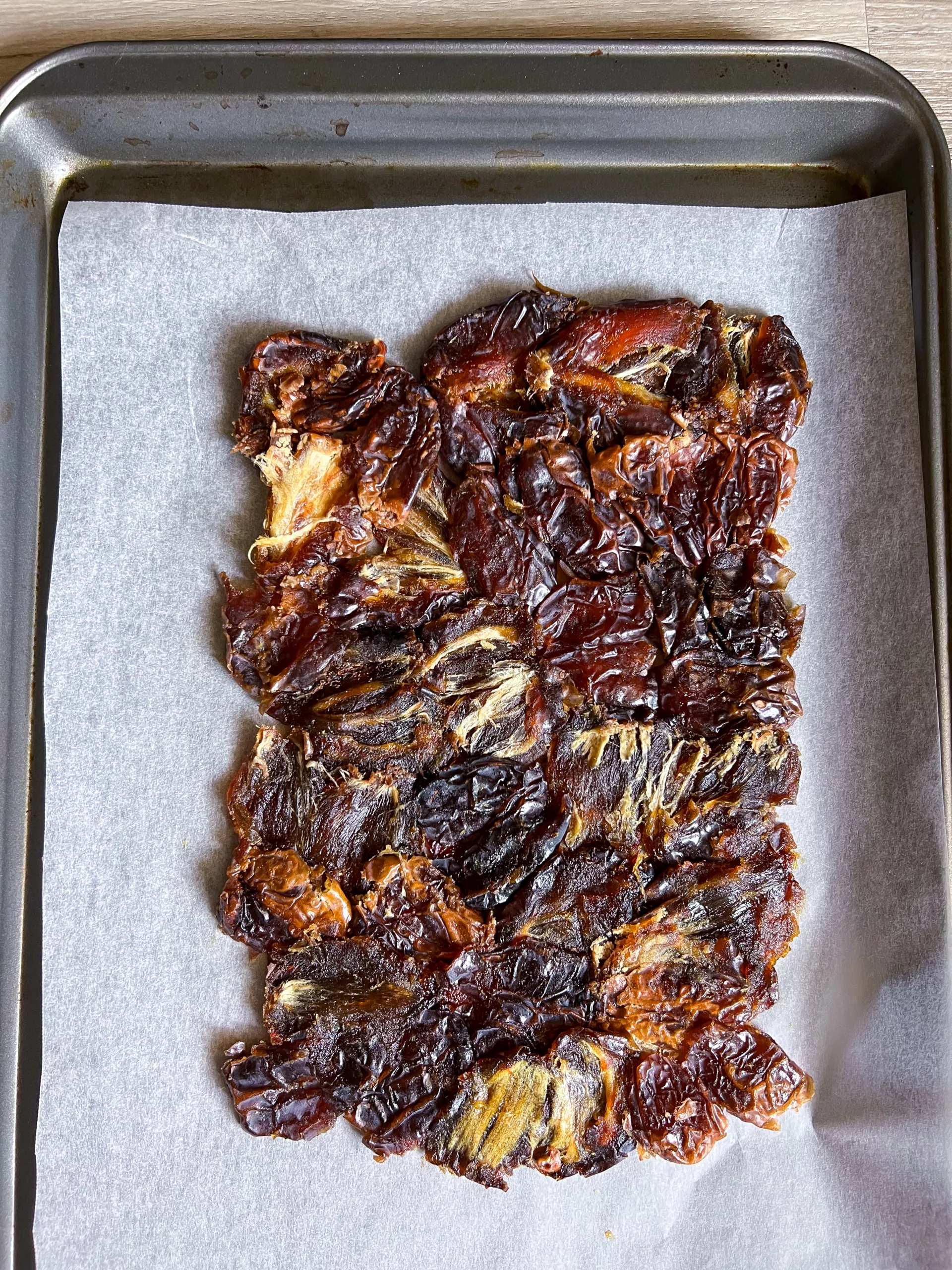 dates pressed on baking sheet