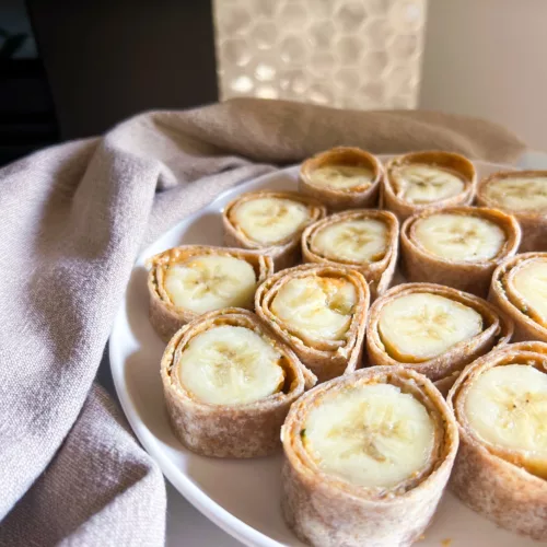 Peanut Butter Banana Roll ups on white plate