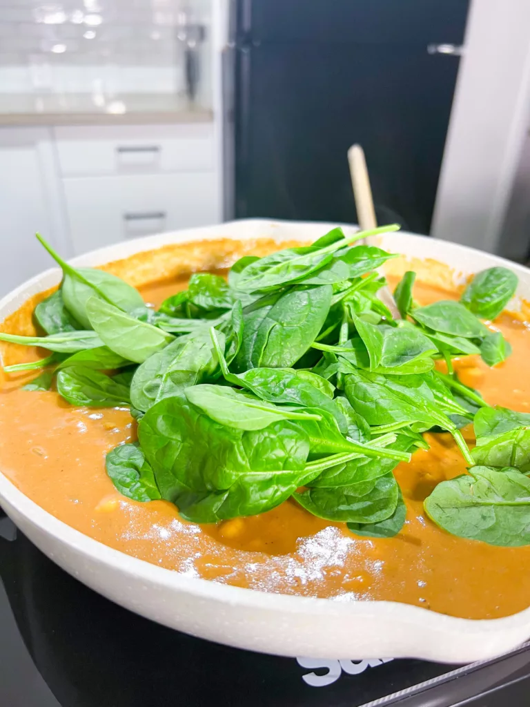 spinach in vegan chickpea curry with peanut butter