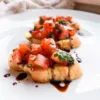 vegan bruschetta recipe on white plate