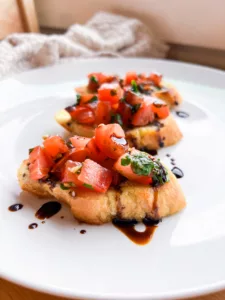 vegan bruschetta recipe on white plate