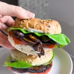 vegan bagel sandwich with plant based mushroom bacon