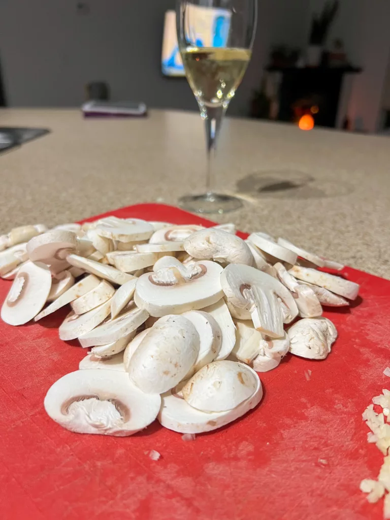 mushroom on red cutting board for risotto