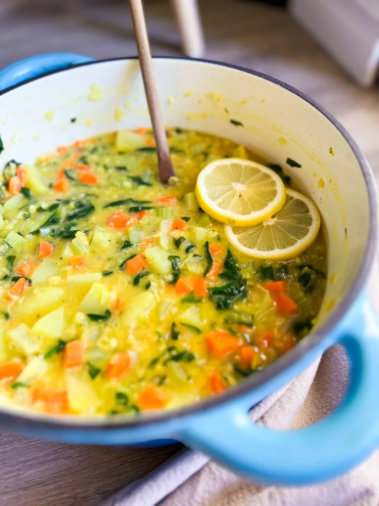 red lentil potato soup with lemons in pot