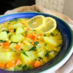 red lentil potato soup recipe with lemons in bowl