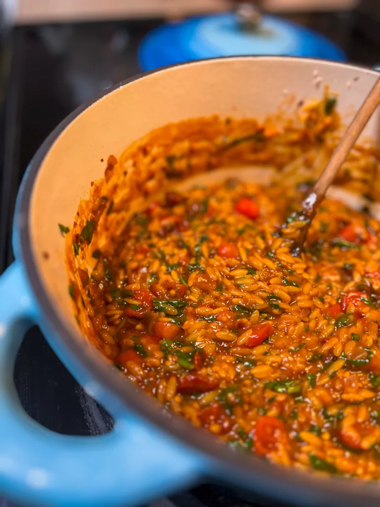 spicy tomato orzo in dutch oven