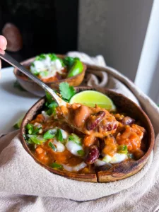 chili recipe vegan in wooden bowl with spoon