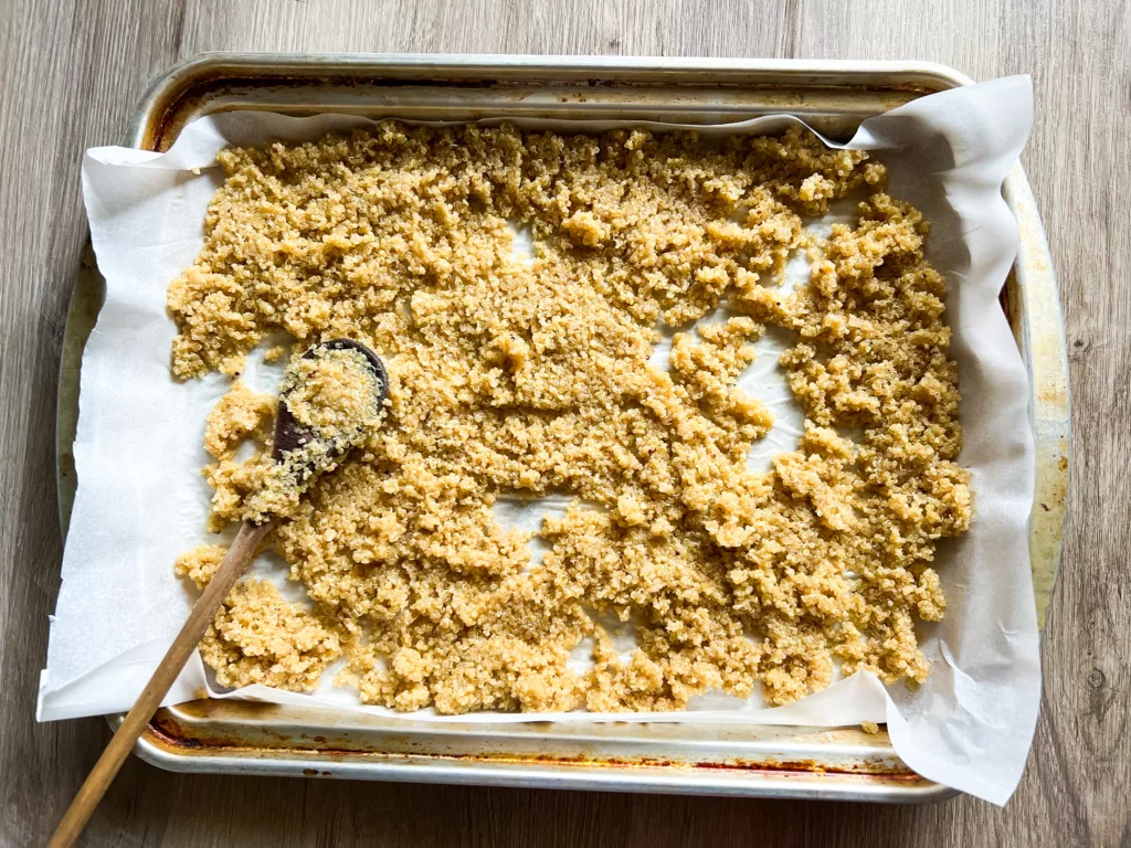 Quinoa on baking sheet with parchment paper