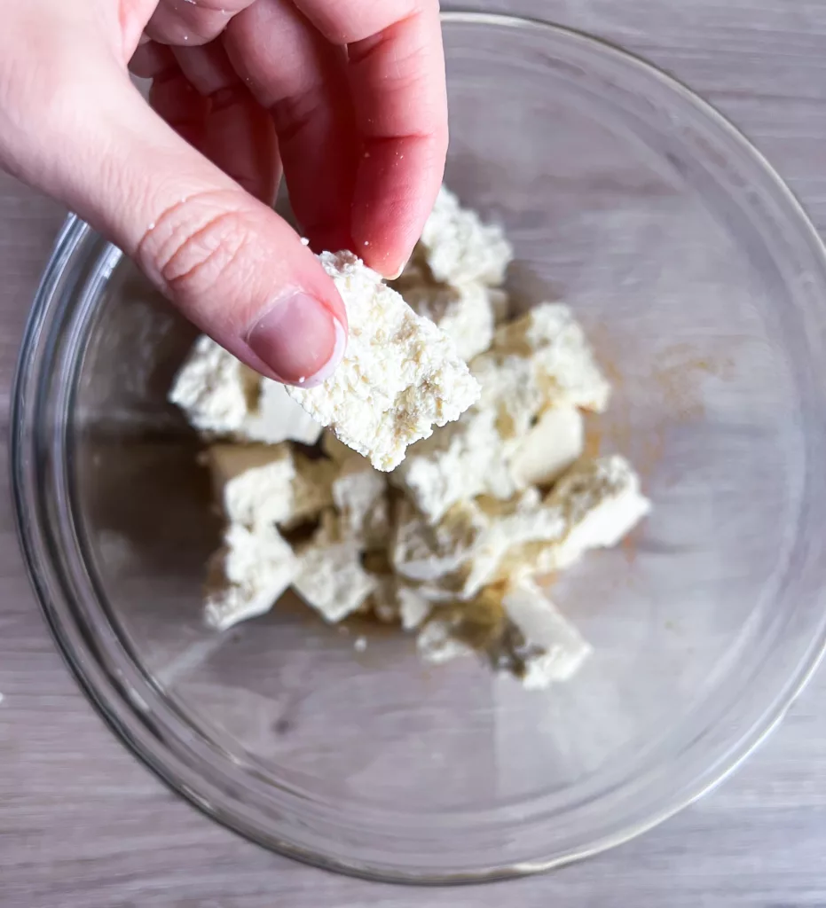 tofu in pieces in mixing bowl