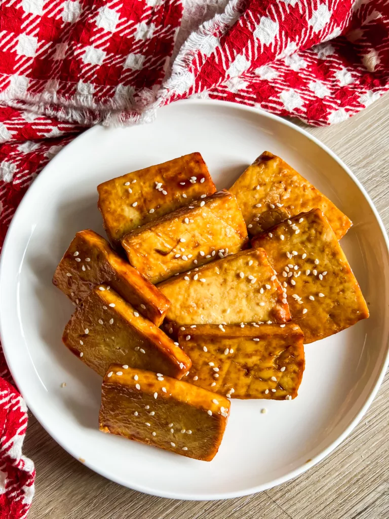 Air Fryer Tofu Steaks with hoisin sauce and sesame seeds