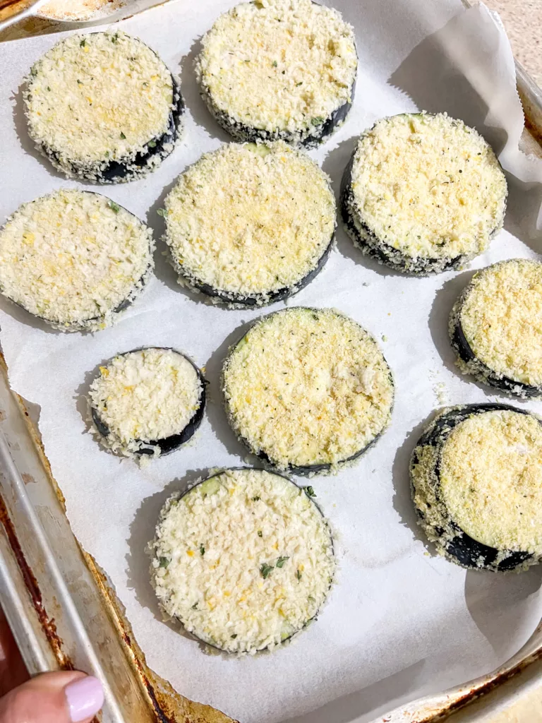 breaded eggplant on baking sheet