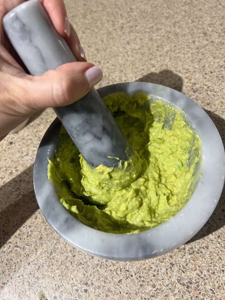 avocado in grey pestle and mortar