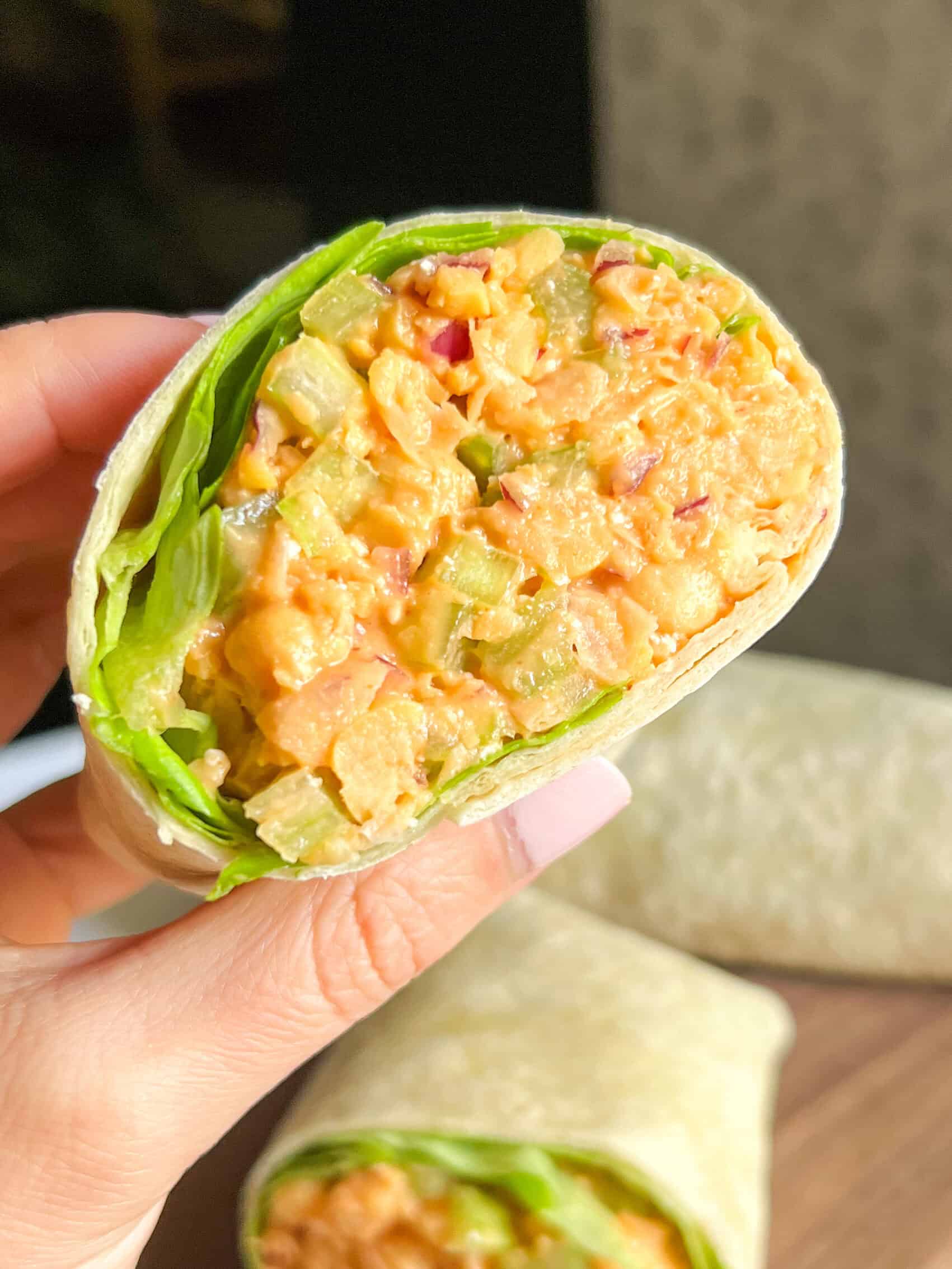 hand holding Chickpea Buffalo Wrap