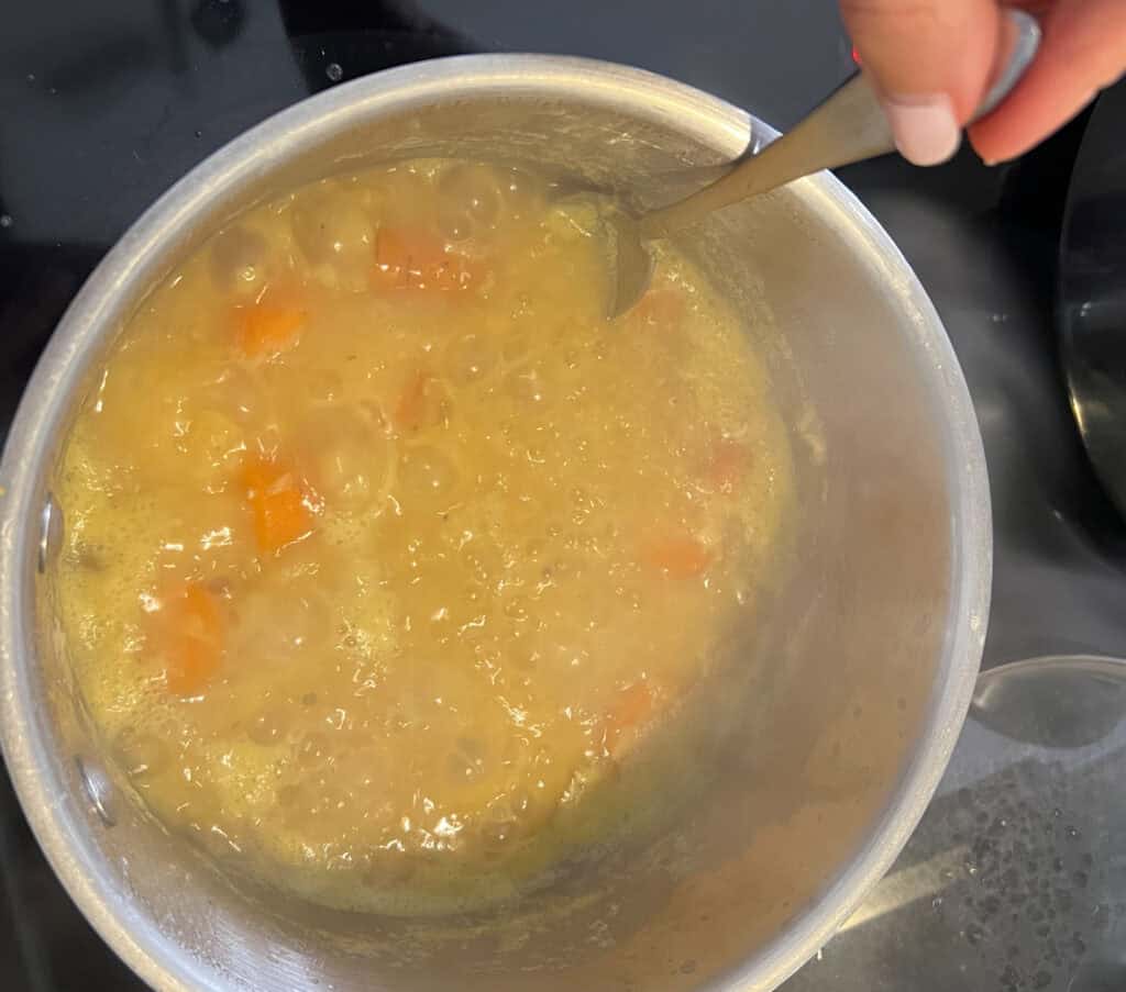 boiling lentils and veggies in pot