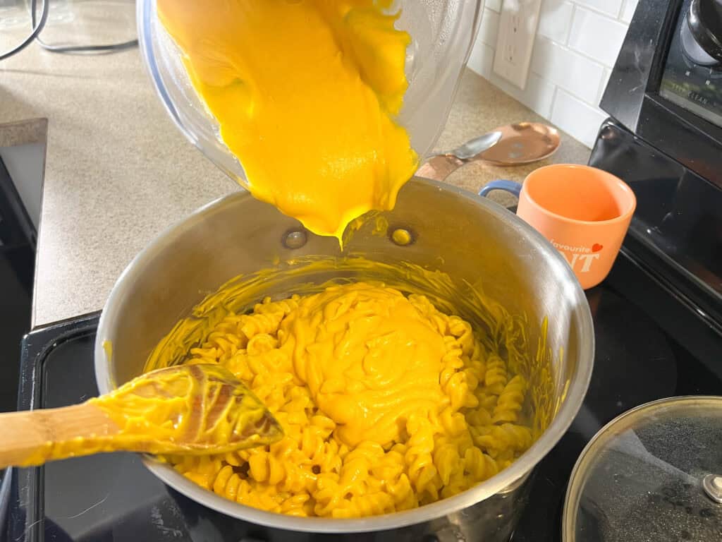 Creamy Lentil Pasta Sauce added to pasta noodles