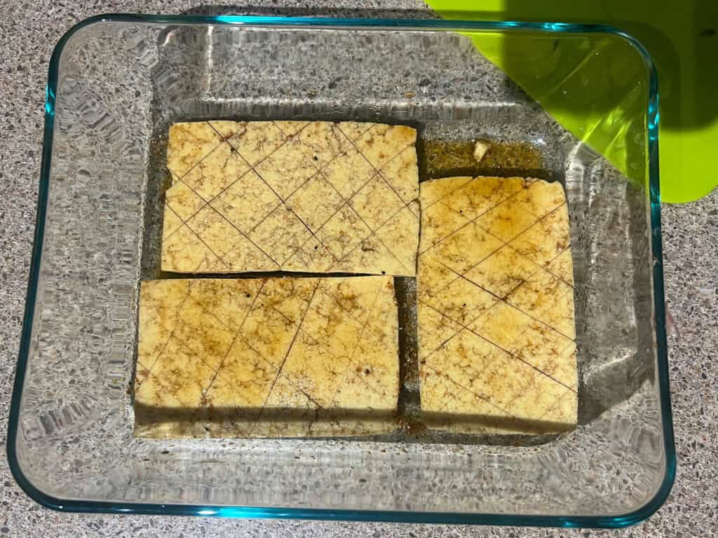 Lemon Pepper Tofu marinating in baking dish