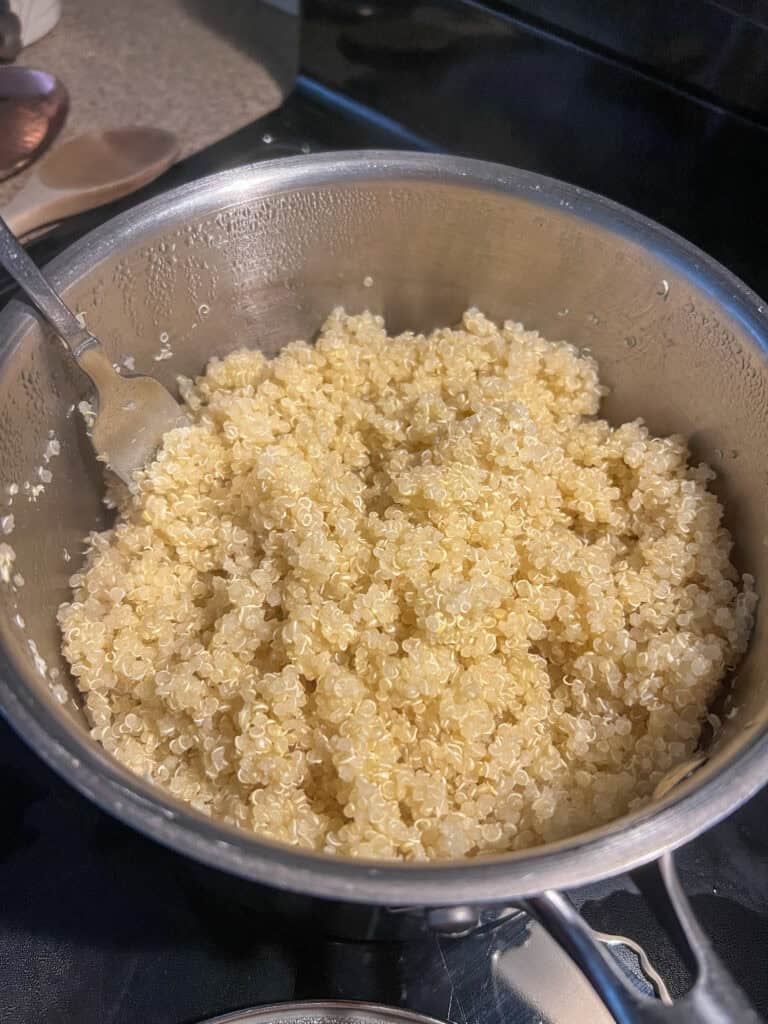 cooked quinoa in stainless steel pot