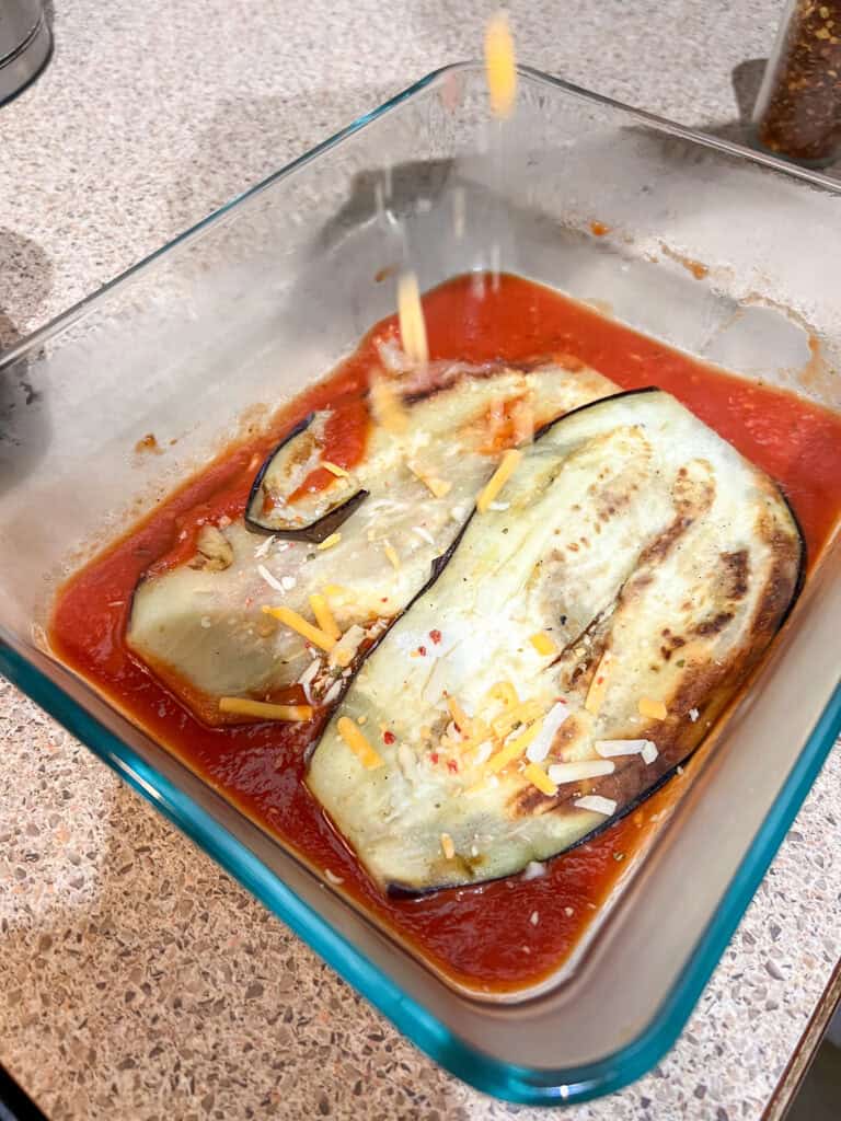 layering the egg plants in a clear baking dish