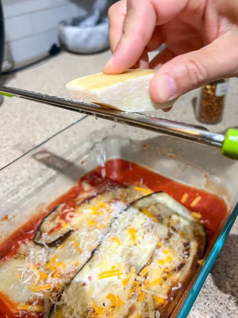 adding parm cheese to the simple eggplant parmesan recipe