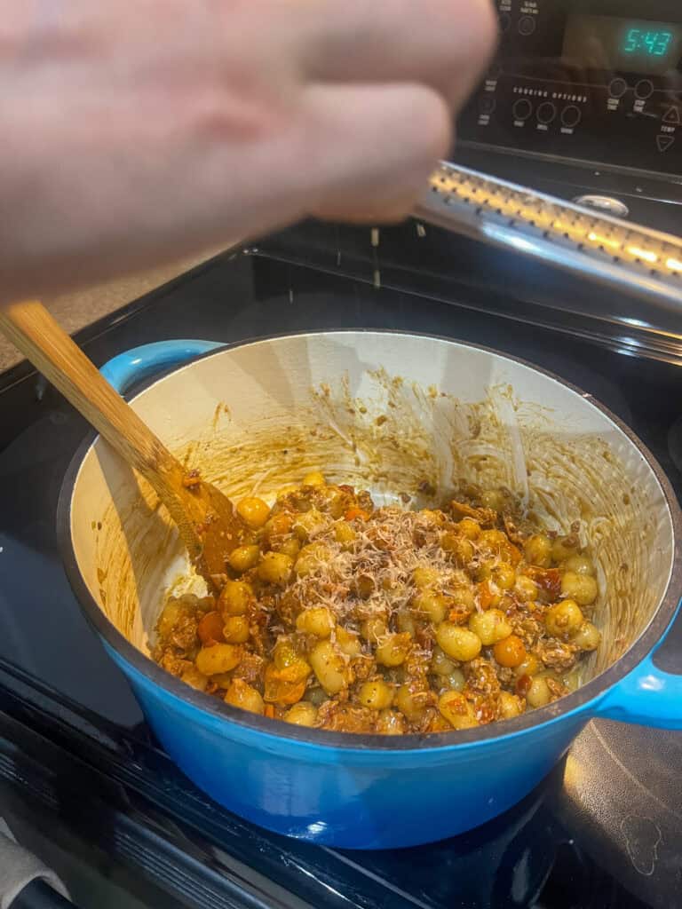 Cherry Tomato & Sun-Dried Tomato Gnocchi (with Vegetarian Sausage) in cast iron pot