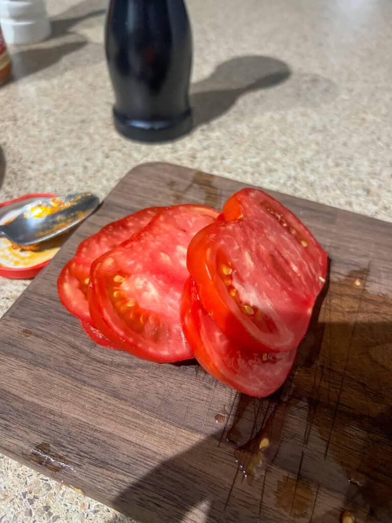 tomatoes on a wood cutting board