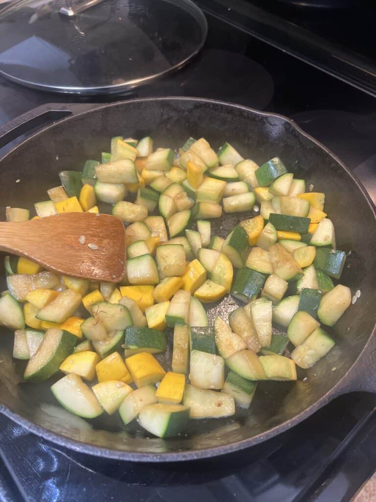 zucchini cooking in cast iron