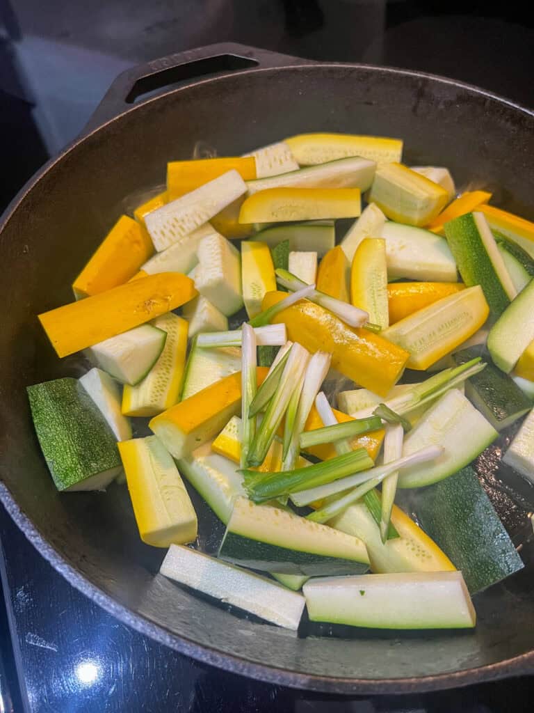 Zucchini on cast iron pan with onions