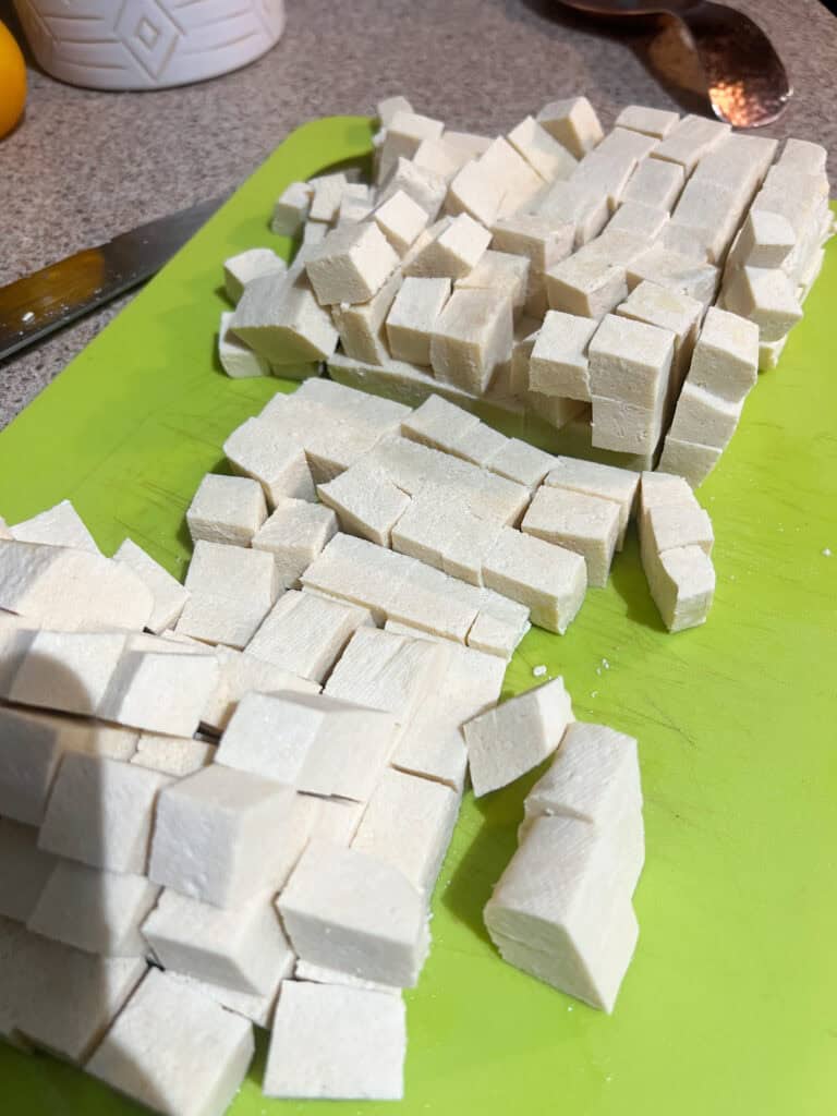 cubbed tofu on cutting board