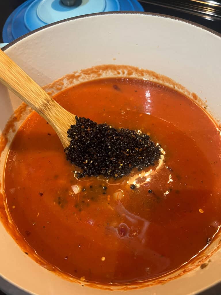 adding black lentils to the mixture