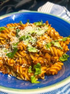 Black Lentil Tomato Sauce with pasta noodles in bowl