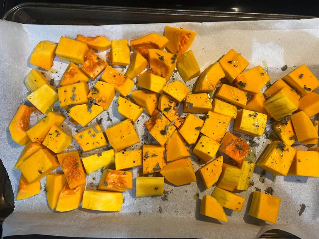 cubed butternut squash on baking tray