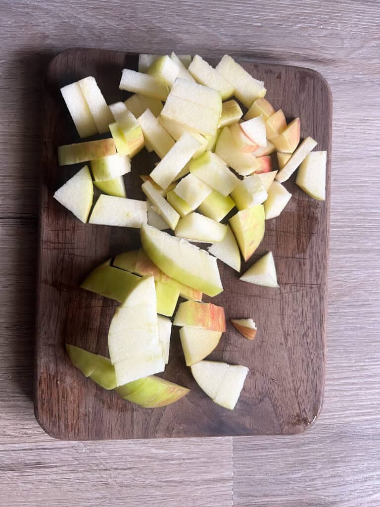 cut up apples on wood cutting board