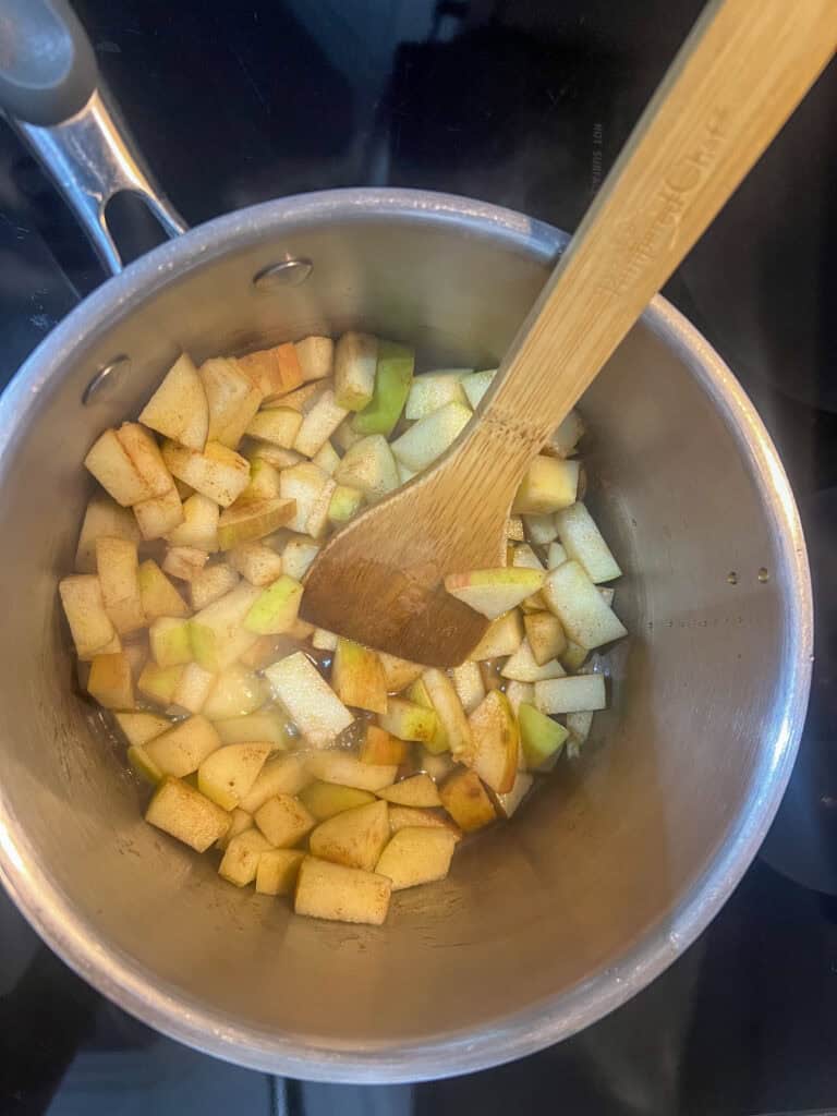 cooking apples in pot on oven