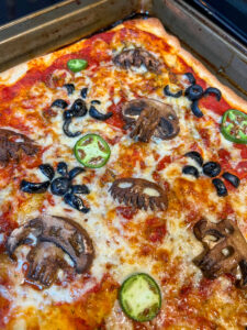 halloween pizzas with skulls and spiders