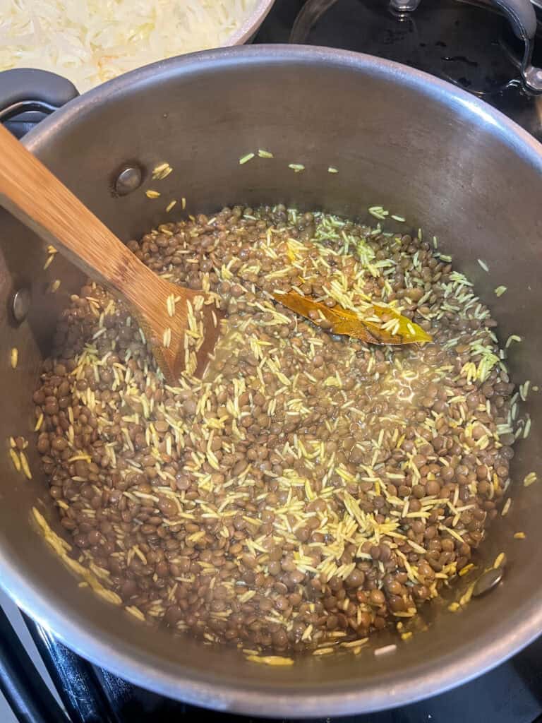 brown lentils with rice in stainless steel pot