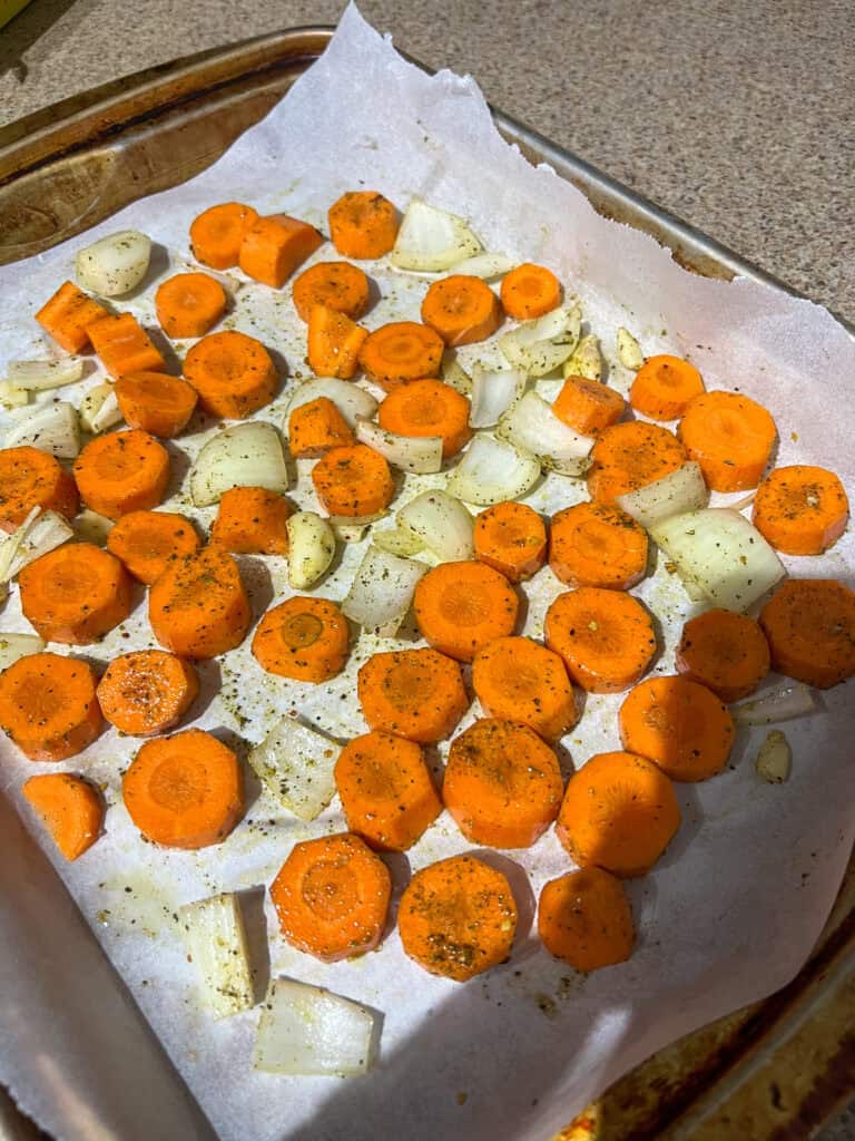 carrots onion garlic on baking tray