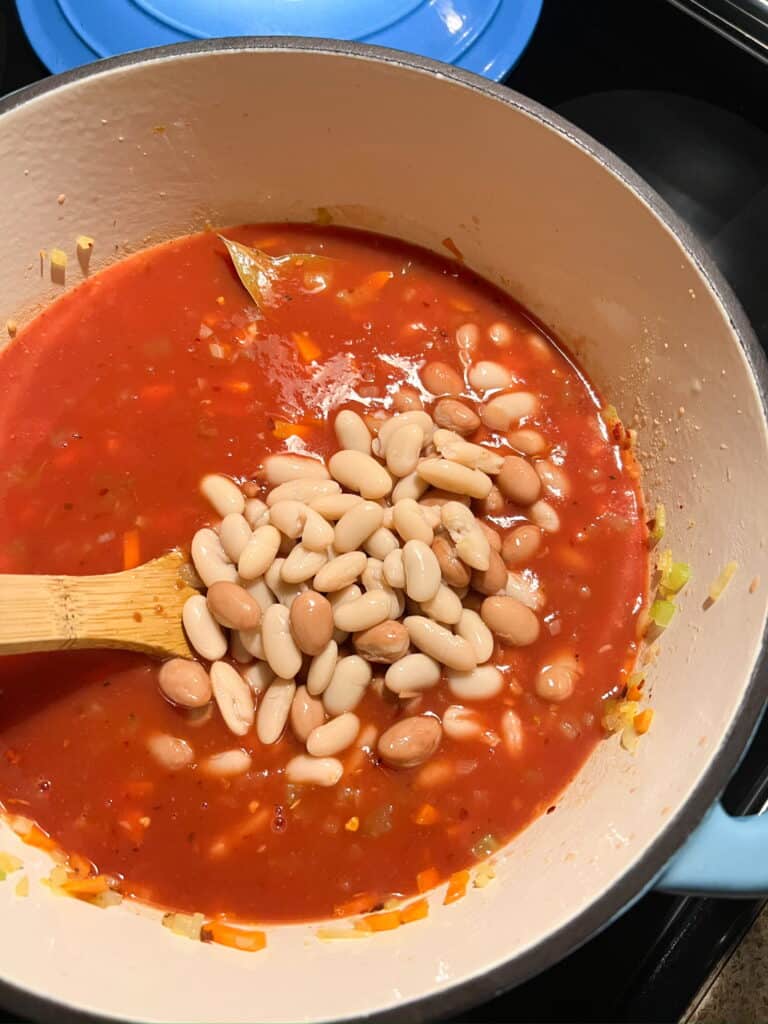 white beans added to the dutch oven