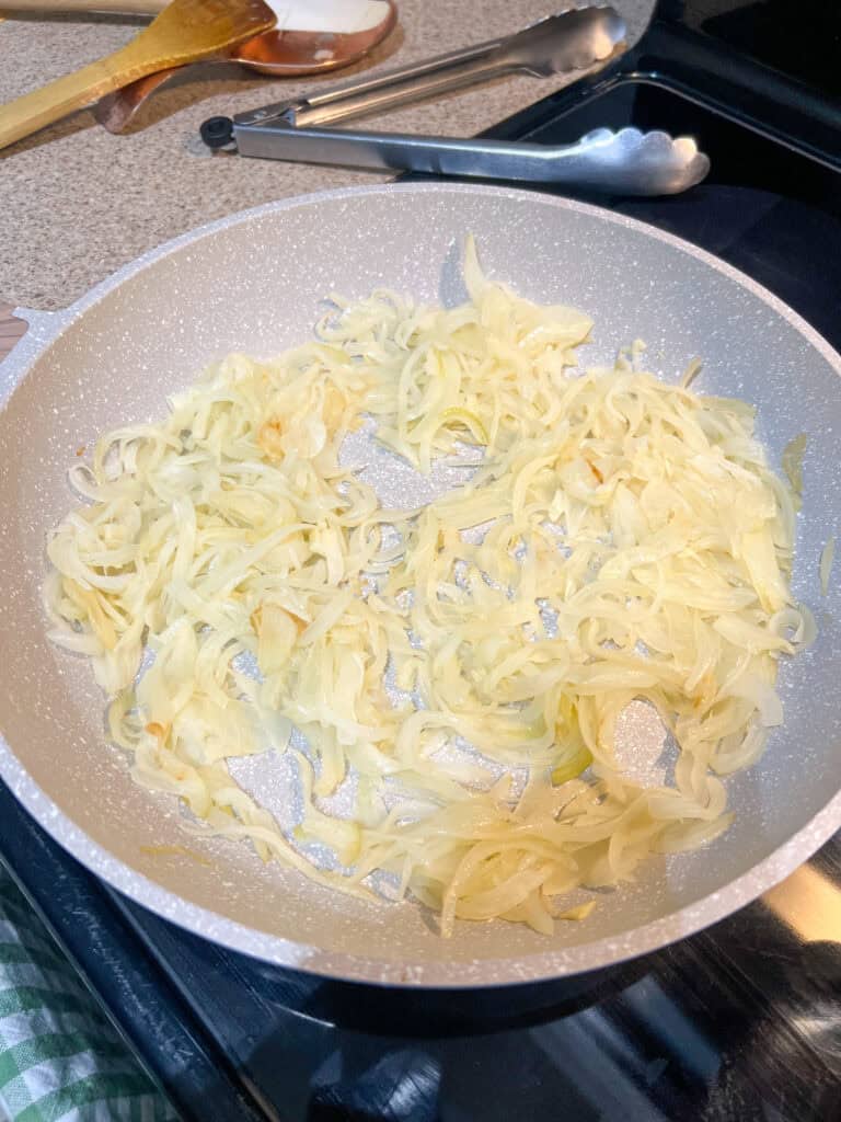 uncooked onions in frying pan