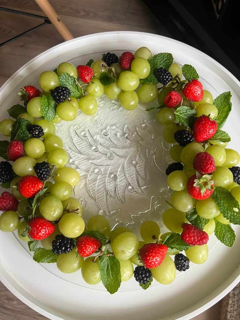 close up fruit wreath grapes berries mint