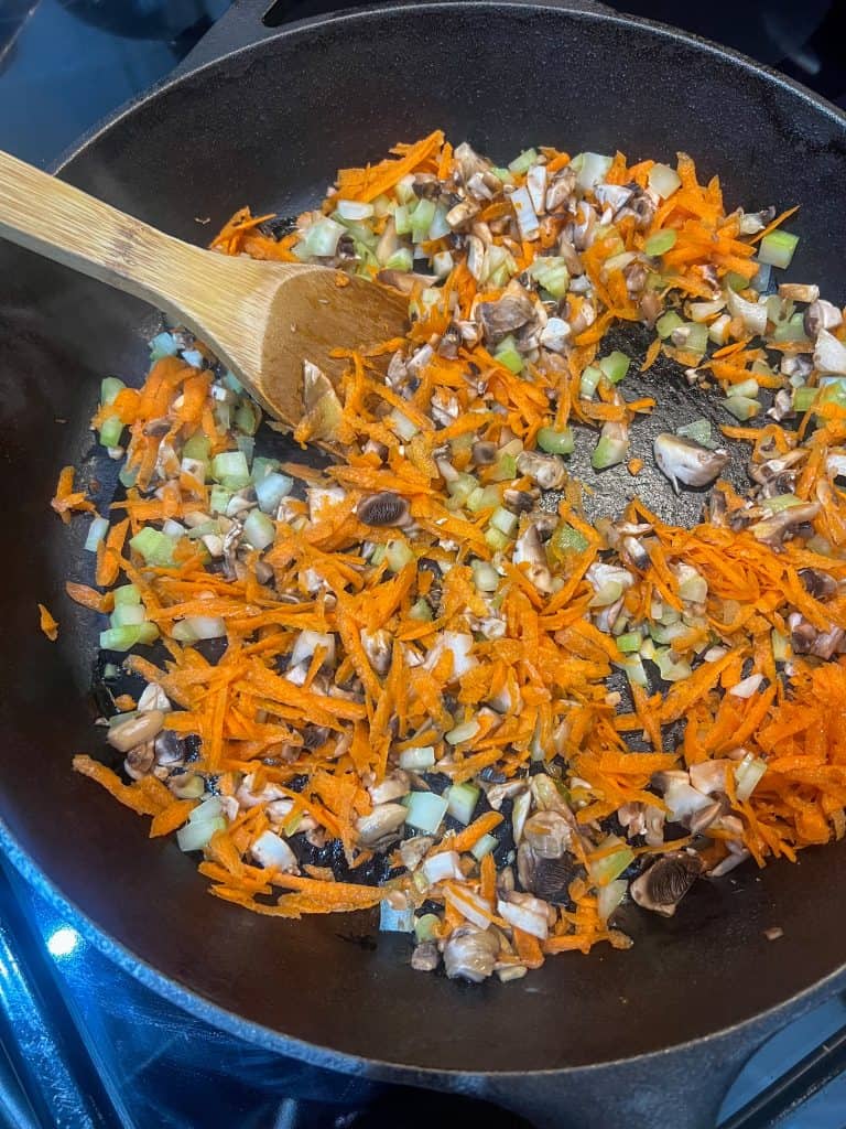 chopped mushroom carrot celery in cast iron